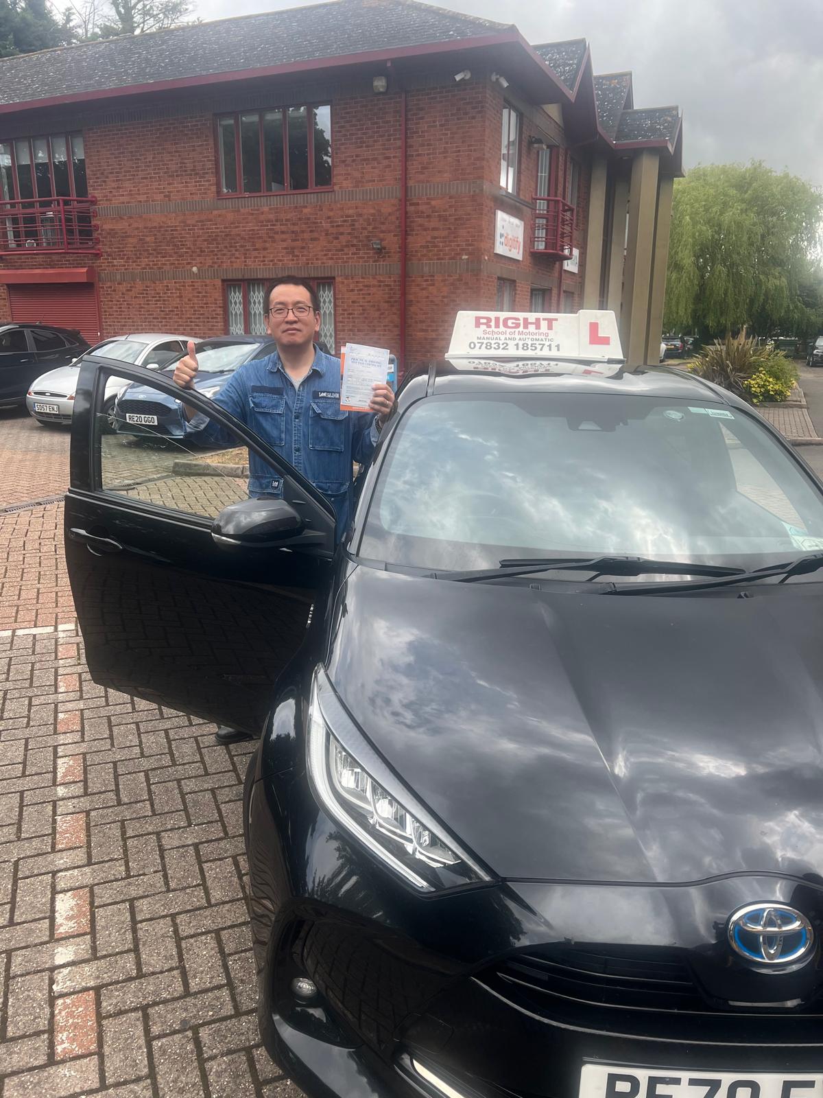 Successful student with pass certificate and Right School of Motoring car