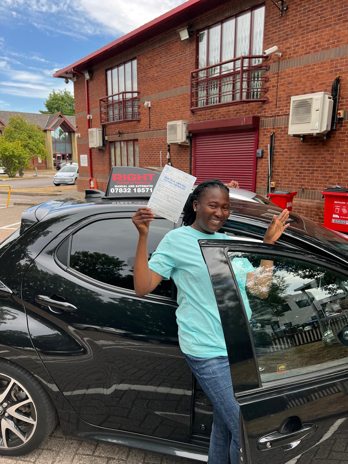 Student holding pass certificate proudly