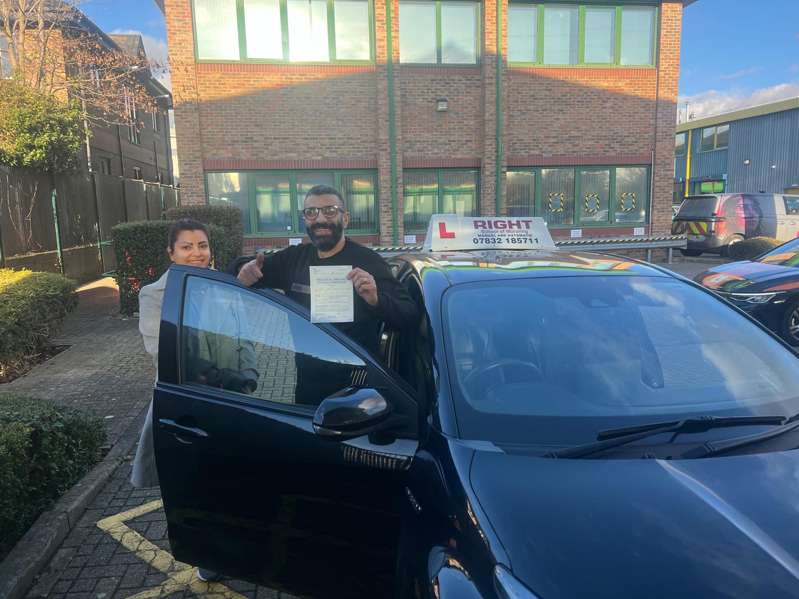 Successful driving student holding pass certificate